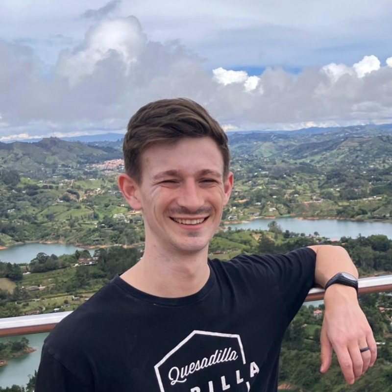 Connor Celum outdoors overlooking a city